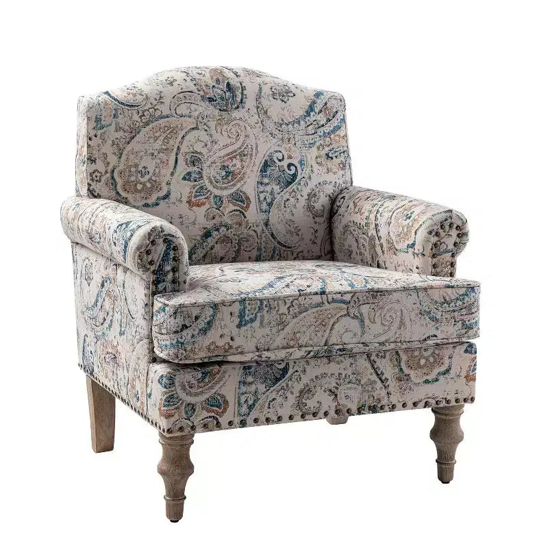 Fauteuil rembourré en bois avec motif floral, accoudoirs à panneaux et dossier en forme de bosse de chameau.